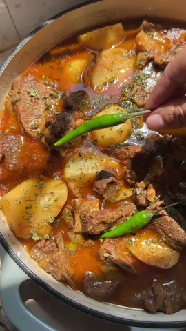 Alu Gosht (potato and meat stew) cooked with so much love. I enjoy this Pakistani dish so much that over the years I have perfected this recipe. You are going to love this! Ingredients: 1/2 kg mutton 2 large onions 6-8 cloves garlic thinly sliced  2 inch julienne cut ginger  @wesson 1/2 cup cooking oil stonyfield 1/3 cup yogurt  @shanfoodsglobal 1 tbsp fenugreek dry leaves  @diamondcrystalsalt 1 tbsp salt  1 tsp cumin powder  1 tsp coriander powder  1 tsp red chili  1 tsp turmeric powder  2-3 green chili  @badiaspices Whole spices aka “garam masala” 1 tbsp coriander seeds 1 tbsp cumin seeds  2 black cardamom  4 cloves  1 tsp black pepper  1 inch cinnamon stick  Instructions: In a pot, pour cooking oil and once it’s hot add ginger and garlic. Fry until golden brown. Remove and then add the onions. Once that’s golden brown too, remove from the oil. Set it aside. In the same oil add the meat. Cook until mutton is slightly cooked and changes color. Now add the powder spices. Mix well and let it cook on a medium heat. While that’s cooking, add yogurt and fried onions, ginger and garlic to the blender. Make a paste and then add it to the meat. Mix it and make sure it’s evenly coated to the meat before adding in the water. Now cook it for 45 minutes or until meat is almost tender. You can also use a pressure cooker for faster cooking time. Then goes in the potatoes. Let that cook with lid on for 15 minutes. Finally sprinkle some fenugreek leaves for the aroma and few whole green chili. Enjoy it with fresh salad and boiled rice!  #alugosht #alu #gosht #pakistanirecipes #pakistanifood #punjabifood #meatandpotatoes #potatorecipes #stonyfield #organic #homemadefood #MadeWithLove #iphone14promax #fyp #fypシ #fypage #fypシ゚viral #pakistanifyp #pakistani_tik_tok #pakistanitiktok #gharkakhana #gharkiyaad #pakistanifoodvideos 