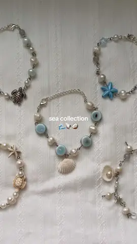 all of my sea inspired bracelets 🌊🥥 #ocean #beachy #oceanjewelry #mermaidcore #sirencore #beach #seashells 