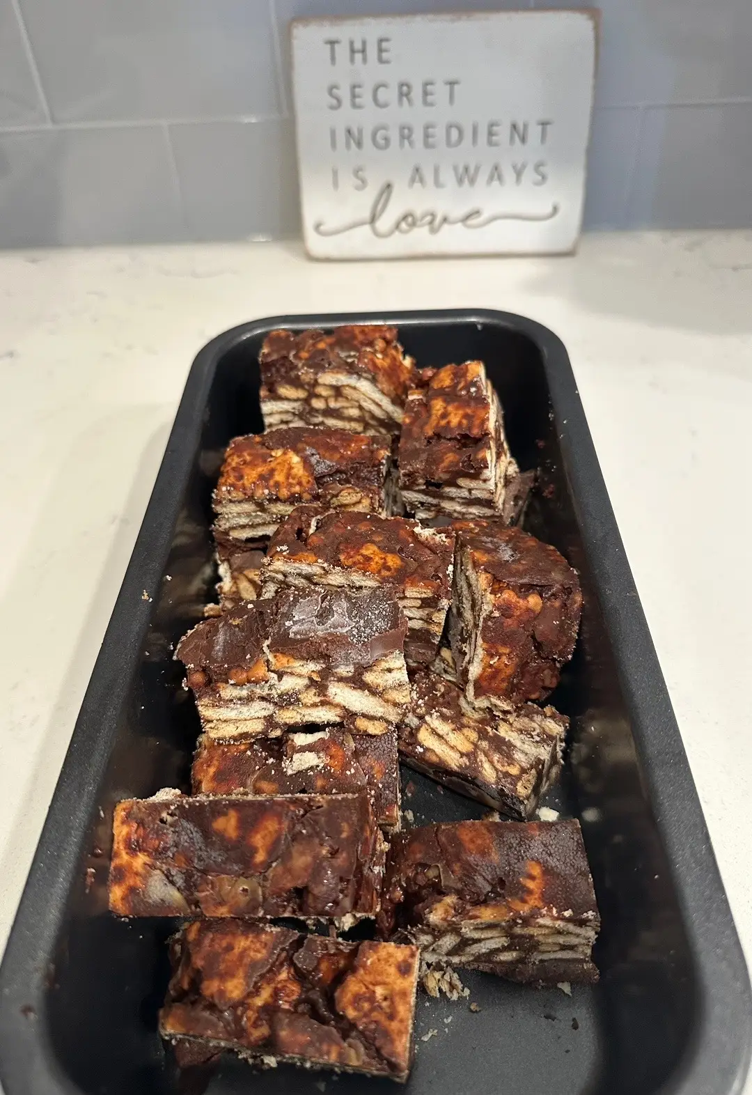 Ingredients: ▪️200 g butter ▪️1/2 cup sugar ▪️1/2 cocoa powder ▪️1/4 cup water ▪️1/4 cup honey ▪️300 g biscuits ▪️100 g chocolate ▪️1/3 cup whipping cream                                                                        Instructions:   1️⃣Break the biscuits into large chunks and set aside. If making the lazy cake in a loaf pan, lightly grease a loaf pan and line with parchment paper.  2️⃣In a large bowl, mix together the melted butter, cocoa powder, honey, water and sugar until smooth and combined. Add the biscuit pieces and fold to combine. Place the biscuit and chocolate mixture into the prepared loaf pan and freeze for 2-3 hours until set.  3️⃣Once firm, slice and enjoy. Store any extra slices in the freezer and enjoy anytime!                                           4️⃣To make chocolate ganache : Place finely chopped chocolate into a heat-proof glass or metal bowl. Heat cream on the stovetop until just simmering. If it’s boiling, the cream is too hot and could separate or even burn the chocolate. Once you see little simmers around the edges, turn off the heat and immediately pour the warm cream over the chocolate. Let the 2 sit for a few minutes before stirring Stir slowly until smooth. Enjoy! #cookwithhaifa #lazycake #food #asmr #viral #LearnOnTikTok #foryou #Recipe 