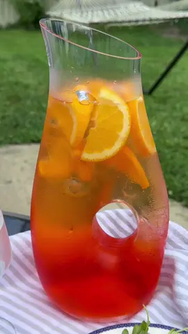 Aperol Spritz 🍊🍹 Ft. My gorgeous @duka_us pitcher 🧡 1.5 cups Prosecco 2 cups aperol 1 cup club soda Oranges (garnish) #cooking #homecook #cookingvlog #cozycooking #aestheticcooking #cozyvibes #cozy #cozytok #minivlog #vlogtok #dailyvlog #slowliving #drink #Recipe #europeansummer