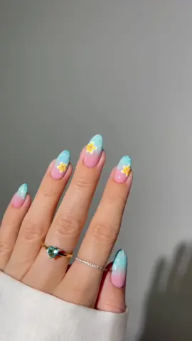 🐬💦🌼🩵🐠 I just captured the essence of a dreamy tropical summer vacation with these frangipani flowers floating in turquoise water on my nails 😌☀️🏝️ *all products are linked on my amzn in the bio #nails #nailart #nailinspo #summernails #bluenails 