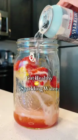 Gut Healthy Honey Strawberry Sparkling Water  Steps: Combine chia seed lemon ice ( see recipe below), honey strawberries ( see recipe below), and sparkling water. Gently mix and enjoy! 🧊🍋🌱Chia Seed Lemon Ice  Steps: In an ice cube tray, add some chia seeds and water (fill water half way). Let sit for 15 minutes and allow chia seeds to bloom and become softer and “jelly”. You can skip this step if prefer.  Add sliced lemons.  Top with more water to fill the ice cube tray.  Freeze for 4 -5 hours or till ice cubes are formed. 🍯🍓Honey Strawberries Steps: Wash and pat dry strawberries. Slice or dice and add in a bowl. Add raw honey. Gently mix.  Keep in the fridge for 30 minutes.  Some fun facts about the key ingredients: Chia seeds: They’re packed with protein, calcium and omega-3 fatty acids. They’re also high in fiber and antioxidants and may support weight loss and heart health.  Lemons:  They’re are rich in vitamin C and can help strengthen immunity. Also, it’s just so refreshing and delicious.  Strawberries:  They are a good source of vitamin C, manganese, and fiber. Raw honey:  It is high in antioxidants and contains prebiotics that supports digestion and gut health. #strawberries #honey #chiaseed #lemons #healthydrinkrecipies #guthealthy #healthydrinkideas #sparklingwater 