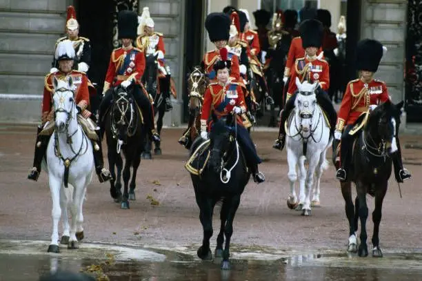 Elizabeth II leading the 1st Battalion Coldstream Guards during the 1982 Trooping of the Colour. Her late Majesty was then joined by the Royal family including a pregnant Princess Diana. #queenelizabeth #theroyalfamily #military #fyp #princessdiana #kingcharles 