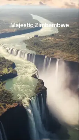 Majestic Victoria Falls 😱🤯 Victoria Falls resides in western Zimbabwe and serves as an entry point to the immense waterfall sharing its name. At this location, the Zambezi River cascades over a precipice, creating the Boiling Pot, before meandering through a sequence of canyons. Positioned on the brink of a steep descent, the Devil's Pool forms a natural infinity pool. Connecting the banks of the river is the Victoria Falls Bridge, constructed in 1905. The encompassing Zambezi National Park provides a habitat for white rhinos and elephants. #havenonearth  #waterfall  #wayerfalls  #zimbabwe  #zimbabwetiktok🇿🇼🇿🇼🇿🇼🇿🇼  #travellife  #travelgram  #BucketListJourney  #TopDestinationGoals  #DreamyHoneymoon  #BestPlacesToVisit  #traveltiktok  #travel  #adventure  #paradise  #zambeziriver  #zambezinationalpark  #victoriafalls  #victoriafallszimbabwe  #water #natureworld_photography #waterfallsoftiktok #watercolornature #landscapewatercolor #natureappreciation #waterfallporn #watercolorlandscapes #waterfalls_collective #waterfall_lover #life #tiktokdaily  #waterresources #landscapeslovers #sky_lovers #igersnature #watercolourpaint #landscapephotos #peaks #beautiphotography #lovenaturephotography #hillsphotography #bestwaterfalls cr: @LandscapePhotography 