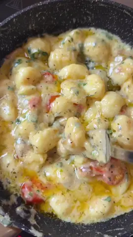   By @chefsofiaa Gnocchi are Italian potato dumplings. You can buy ready-made gnocchi, but homemade gnocchi are often tastier, especially since you can experiment with the composition of the dough))) Preparation of classic gnocchi: 1. Peel 1 kg of potatoes, fill with water and put on fire. (even baked potatoes are better) 2. Mash the boiled potatoes with a crush and leave to cool. 3. Add 3 eggs and 200 g of flour to the puree and mix all the ingredients. Knead the potato dough, it should be airy and stick to your fingers a little. 4. Pour a little flour on the work surface, roll out a plump cake and cut it into strips, which in turn need to be divided into small pieces. 5. Form oval dumplings, make cuts with a toothpick or fork. Choose a pattern to your liking. It can be both parallel and intersecting lines. For sauce: 1. Butter 35 g 2. A little olive oil (+/- 20g) 3. Cherry tomatoes 6-7 pcs 4. Thinly sliced ​​garlic 2 pcs 5. Cream (I have 18%) 80 g 6. Natural yogurt (I have Greek) 80 g 7. Gnocchi (classic) 300 g 8. Mozzarella 100 g + Parmesan 50 g 9. Fresh parsley (finely chopped) 10. Dried basil (if fresh, even better) 🎦 The video clearly shows the cooking process, if you have any questions write in the comments ✅ Bon appetit ❤️ #gnocchi #potatodumplings #gnocchi #dumplings #italian #recipes