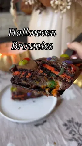 Halloween Brownies!🎃 All the best Halloween treats baked into one!👻  1. Layer 1 - Pilsbury pumpkin cookies 2. Layer 2 - BOO Oreos  3. Layer 3 - Brownie Batter  4. Top with Ghouls Mix M&Ms Bake for 45 min on 350!  #HalloweenTreats #halloweenbrownies #halloweendessert 