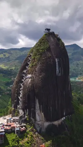 El Peñón de Guatapé (The Rock of Guatapé) in Colombia ⛰️🏞️🇨🇴  . 🎥 IG/world_walkerz . 📱 #ExploreMore & #TravelBetter with our free #TravelApp. Link in bio. . #tripio #medellín #colombia #elpeñol #peñol #guatape #colombiatravel #antioquia #visitcolombia #travel #traveltiktok #traveltok #tripioapp 