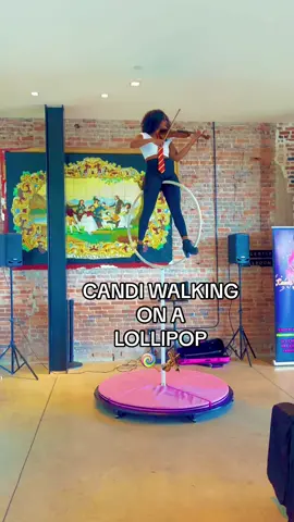 🍭🎻🪄Come with me to “A Wizarding Wedding” with @swelevents at the beautiful @hotelhaya in historic Ybor, FL!  This amazing networking soirée infused with a Harry Potter theme did everything but disappoint! IYKYK I live for a good theme and an excuse to play dress up! I showcased my aerial lollipop package and got to do one of my newest tricks, “Candi walking on a Lollipop”, and the guests absolutely loved it!  If you’re looking for just a violinist, with all due respect, don’t call me! 😅🤣 However, if you are looking for a unique one of a kind entertainment experience by a violinist,  go ahead and click that link in my bio and let’s start planning your epic event today! 😉 #explorepage #violinist #electricviolin #networking #networkingevents #corporateevents #luxuryevents #weddingplanner #eventplanner #livemusic #livemusician #blackfemaleviolinist #blackviolinist #tampa #miami #orlando #stpete #florida #suncoast #entertainment #fyp #blackgirltiktok 