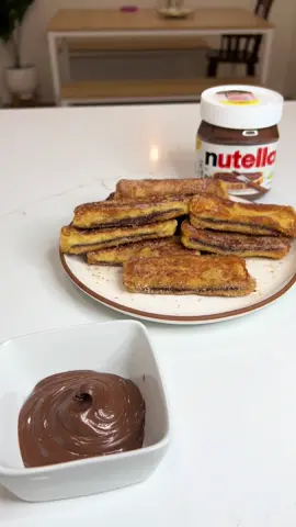 Nutella stuffed French toast sticks😍❤️ coated in cinnamon sugar  Ingredients:  White bread Nutella Egg Vanilla Butter Cinnamon sugar mixture More Nutella😍 Enjoy 🫶🏼 Ingredientes:  Pan blanco Nutella Huevo Vanilla Mantequilla Canela y azúcar  Mad Nutella😍 Buen provecho 🫶🏼 #asmr #asmrcooking #asmrfood #nutella #Recipe #gabrielavlogs 