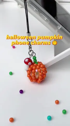 Halloween pumpkin phone charms 🎃 #beads #beadjewlery #topaccdiy #DIY #keychaintutorial #beadkeychain #camerastrap #phonecharm #tutorial #handmadejewelry #fyp #foryou #halloween #halloweenkeychain 