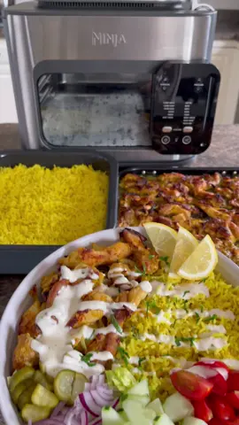 Chicken Shawarma rice bowls using the new Ninja Combi. #SponsoredbyNinja This entire meal took me less than 30 minutes to prep and cook. With the Ninja Combi you can cook proteins, rice and vegetables all at the same time. The Ninja Combi is an all-in-one multicooker, oven, air fryer that lets you cook complete meals for your whole family in just 15 minutes. Amazing. @NinjaKitchen  #ninjacombi #ninjakitchen #lazycooking   —CHICKEN INGREDIENTS— 5 skinless boneless chicken thighs (cut into thin bite size strips) 1 large onion (sliced thin) 5 cloves garlic (minced) 1/2 cup plain yogurt The juice 1/2 lemon 2 tablespoons olive oil 2 teaspoons salt 1/2 teaspoon garlic powder 1/2 teaspoon onion powder 1/2 teaspoon paprika 1/2 teaspoon cumin 1/2teaspoon coriander 1/4 teaspoon chili flakes 1/4 teaspoon turmeric 1/4 teaspoon cinnamon 1/4 teaspoon black pepper : —RICE INGREDIENTS— 2 cups basmati rice (rinsed) 3 tablespoons olive oil 1/2 teaspoon turmeric 1/2 teaspoon cumin 2 teaspoons salt 4 cups chicken broth : —WHITE SAUCE— 1/2 cup of mayonnaise 1/2 cup of plain yogurt 1 clove garlic (minced really well) or 1 tsp garlic powder 1 tablespoon of white vinegar 1 tablespoon of lemon juice 1 teaspoon of sugar salt and pepper to taste : 1. Cut the chicken thighs into thin bite size strips. Add the chicken into a large bowl add the onions, garlic, plain yogurt, lemon juice, olive oil and all the spices, mix and marinate for about 30 minutes, if you have time marinate longer. Transfer the chicken into the Ninja Combi bake tray. 2. Rinse 2 cups of basmati rice until the water runs clear. Put the rice in the Ninja Combi pan, add the olive oil, turmeric, cumin, salt pour 4 cups of chicken broth on top and give it a stir. 3. Place the trays into the Ninja Combi, slide the the pan into level 1 and the bake tray into level 2. Power the combi on, turn the smart switch to combi cooker, select combi meals, set the temperature to 350° and set the timer for 15 minutes. Press start and let the Combi do its magic. 4. Once done plate with some cut veggies like lettuce, cucumber, tomatoes, red onions and pickles. Drizzle the white sauce on top and enjoy. 