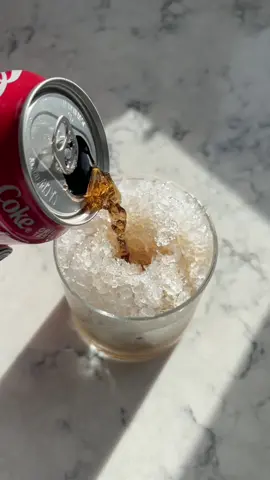 Coke over shaved ice with w little bit of lime ….. wow 