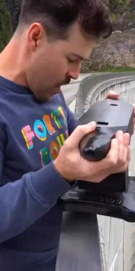 Throwing a rock on a car from 2400 feet up!