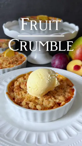 Fruit Crumble Recipe 👩🏻‍🍳 This fruit crumble featuring juicy apples, pears, and plums, tenderly enveloped in orange juice and topped with crunchy oat-cinnamon streusel, is a true delight. The enticing aroma wafting through the kitchen as it bakes is just a preview of the delectable experience that awaits you. 🍊 Ingredients: - 1 apple, peeled, cored, and diced - 1 pear, peeled, cored, and diced - 2-3 plums, pitted and diced - Juice of 1 orange - 50 g oats - 50 g flour - 40 g sugar - 40 g butter, cold and cut into small pieces - A pinch of cinnamon - A pinch of salt - Vanilla ice cream for serving (optional) 👩🏻‍🍳 Preparation: 1. Preheat the oven to 200°C. 2. Place the diced apples, pears, and plums into a baking dish. 3. Pour the orange juice over the fruit and gently mix. 4. Combine oats, flour, sugar, butter, cinnamon, and salt in a bowl until coarse streusel forms. 5. Sprinkle the streusel over the fruit in the baking dish. 6. Place the baking dish in the preheated oven and bake for approximately 25-30 minutes until the streusel is golden brown and the fruit is tender. 7. Remove from the oven and allow it to cool slightly. Serve with vanilla ice cream if desired. Indulge in this delightful fruit crumble, quick to prepare and especially delicious when served warm from the oven! Enjoy! 👩🏻‍🍳  #crumble #fruitcrumble #dessert #Recipe 