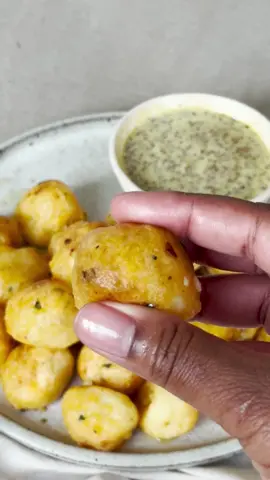 Air-fryer potato pops 🥔 Serves 4 (makes 32 pops) 800g Maris Piper potatoes, peeled and chopped 80g salted butter 3 garlic cloves, crushed 5g flat-leaf parsley, finely chopped 50g-60g cornflour ½ tsp paprika  spray oil 2 tbsp wholegrain mustard 1 tsp American mustard 3 tbsp mayonnaise 1 tbsp runny honey 1. Bring a pan of water to the boil and add the potatoes. Bring back to a simmer and cook for 15-18 mins, until falling apart when pierced with a fork. Drain well and let steam dry in the colander for 5 mins. 2. While the potatoes are cooking, make the garlic butter. Put the butter, crushed garlic and chopped parsley into a small saucepan and cook over medium heat for 2-3 mins until the butter is sizzling and the garlic is fragrant. 3. Mash the potatoes until smooth and spoon in half of the garlic butter. 4.  Season with salt and plenty of black pepper and add the cornflour and paprika. Stir until well combined; it should be a stiff dough texture. 5. Use a tablespoon to portion the dough and rolled into 32 balls. 6. Preheat the air-fryer to 200°C. Spray the basket of the air-fryer and the potato balls well with oil and cook for 18-20 mins, turning after 10 mins until golden brown. 7. While the pops are cooking, make the dipping sauce by stirring together the mustards, mayo and the honey in a small bowl. 8. When crispy and golden brown, tip the potato pops into a bowl and drizzle over the remaining garlic butter, tossing to coat. Serve immediately along with the dipping sauce. Tip: You can add whatever your favourite seasonings are to these pops to customise them. #potatopops #garlicrecipes #viralrecipes #tesco #ASMR 