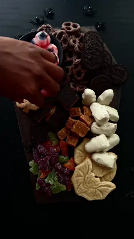 Get into the spooky spirit with this devilishly delicious snack board for your next halloween party 🤍 #halloween #halloweenparty #spookyszn #pumpkinpatch #charcuterieboardsoftiktok 