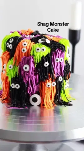 I made a mini version of my monster shag cake in a Halloween color palette and 👀 it’s so cute! My one regret is not following my own tutorial and piping the shag from the bottom to the top of the cake so the monsters would have looked more layered. Follow the tutorial at sugarandsparrow.com/monster-shag-cake-tutorial/ to make it even better! ⁣ ⁣ 🎨 colors: @americolor Electric Green, Electric Purple, Electric Orange, and my new dye-free black buttercream from a few Reels back⁣ ✨piping tip: @wiltoncakes 233⁣ 👀 googly eyes: @joann_stores⁣ ⁣ #shagcake #halloweencake #monstercake #minicake #buttercream #pipingskills #cakedecorating #halloween #cakesoftiktok #satisfyingfood #cakes 