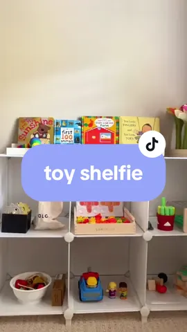 We just added a book shelf on top of the toy shelf and love it so much because the books are perfectly displayed!  Toys in order as you see in the video ⬇️ 1. Lalo gears toy (from the 22-24 play kit) 2. Books + caterpillar fidget toy  3. Lovevery flower planting toy (from the helper kit) 4. Lovevery wooden posting stand (from the companion kit) 5. Lalo lacing beads (from the 22-24 month play kit) 6. Walmart Vehicle + Fisher price figurines 7. Lovevery puzzle (from the companion kit)  8. Lalo nuts and bolts (from the 22-24 play kit)  #toyrotation #toddlertoyrotation #toddlergiftideas #toddlerchristmasideas #toyshelfie #toddlertoys #tovrotationideas #toddleractivities #playroominspo #momonabudget 