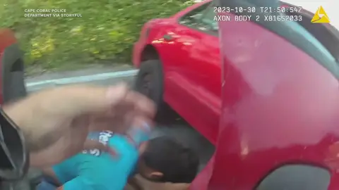 Bodycam footage shows how two Florida policemen rushed to lift a vehicle off a man who became trapped underneath after his car jack failed on Monday. #rescue #bodycam