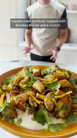 Masala roast potatoes 🥔  Serves 4 750g baby potatoes 4 tbsp sunflower oil 2 tbsp garam masala 1 tsp chilli flakes (optional) 30g fresh coriander, a few leaves set aside to garnish 2 limes, juiced 1 lemon, juiced 200g Greek yogurt 3 tbsp mango chutney 3 tbsp Bombay mix 1. Preheat the oven to gas 7, 220°C, fan 200°C. Put the potatoes in a large saucepan of water and bring to the boil over a high heat. Turn down the heat and simmer for 20 mins until tender. Drain and transfer to a baking tray. 2. Using the back of a spoon, carefully squash the potatoes into the tray. This will give you lots of crispy edges. Drizzle over 3 tbsp of the oil and sprinkle over the spices and chilli flakes (if using). Roast for 25-30 mins until golden and crisp, turning halfway through. 3. Meanwhile, using a stick blender, whizz the coriander with the lime juice, half the lemon juice and the remaining oil. Combine the yogurt with the mango chutney and remaining lemon juice. Set aside. 4. When ready to serve, spread the yogurt sauce over a serving plate or platter, spoon over the crispy potatoes and drizzle over the coriander dressing. Top with the Bombay mix and reserved coriander leaves. #masalaroastpotatoes #ASMR #roastpotatorecipes #potatorecipes #vegetarianrecipes #masala ﻿#Tesco