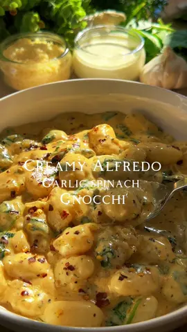 “When garlic, spinach, and gnocchi meet creamy Alfredo sauce, it’s a flavor explosion in every bite.  Ingredients: * 16 ounces potato gnocchi * 3 tablespoons unsalted butter * 2 tablespoons olive oil  * 3 cloves garlic,sliced  * 1 small onion chopped  * 1 cup heavy cream * 3 tablespoons cream cheese  * 1 teaspoon paprika  * 1 teaspoon dried parsley  * 1/2 teaspoon cayenne pepper powder  * 1/2 teaspoon dried oregano  * Salt and black pepper to taste * 1 cup grated Parmesan cheese * 2 cups fresh spinach leaves * Red chili flakes (for garnish, optional) Full recipe on my Youtube channel, Link is in the Bio!  #Recipe #gnnocchi #foodies #creamy #foodiesoftiktok #foryou #fypage #recipesoftiktok #homemade #alfredo #alfresco #italian #italianfood #FoodLover #pasta #pastatiktok #fypシ #fypシ゚viral #fyp 