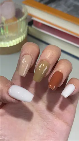 Embrace the fall vibes with nails that speak the language of autumn leaves 🍂🍁. A cascade from milky whites to warm spice, these shades are a cozy sweater for your fingertips! #fallnails #cozynails #nailtrendsetter