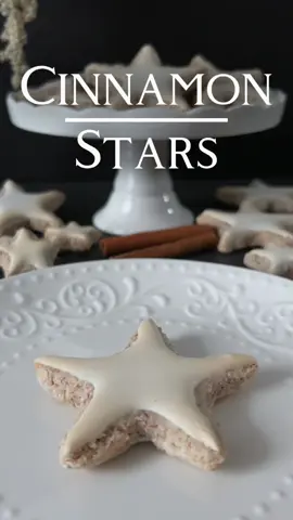 Cinnamon Stars Recipe 🤍 Embark on a journey into a realm of delightful flavors, where finely ground almonds and aromatic cinnamon converge into an irresistible taste. 📝 Ingredients: For the Cinnamon Stars: - 220 g ground almonds - 200 g powdered sugar - 1-2 teaspoons cinnamon - 2 egg whites - A pinch of salt For the Glaze: - 1 egg white - 100 g powdered sugar 👩🏻‍🍳 Preparation: 1. Merge ground almonds, powdered sugar, and cinnamon in a bowl. 2. Whip egg whites with a pinch of salt until stiff peaks form. 3. Gently fold the egg white mixture into the almond-cinnamon blend, adding more ground almonds if necessary until a homogeneous dough forms. 4. Wrap the dough in plastic wrap and let it rest in the refrigerator for about 1 hour. 5. Preheat the oven to 160 degrees Celsius. 6. Roll out the dough on a lightly floured surface or between two sheets of parchment paper to a thickness of 0,5 cm and cut out star shapes. 7. Place the cinnamon stars on a baking sheet lined with parchment paper. 8. For the glaze, beat the egg white until stiff and gradually mix in the powdered sugar. Chill until ready to use. 9. Brush the cinnamon stars with the egg white-powdered sugar glaze. 10. Bake in the preheated oven for about 10-12 minutes or until the edges are lightly golden. 11. Remove the cinnamon stars from the oven and let them cool completely. Savor these cinnamon stars as a festive treat! 👩🏻‍🍳