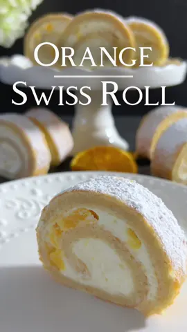 Orange Swiss Roll Recipe 🤍 A refreshing delicacy that enchants the senses with the aroma of fresh oranges! This airy Swiss Roll is not only a delight for the palate but also a feast for the eyes. 📝 Ingredients: For the Sponge: - 100g ground blanched almonds - 100g powdered sugar - 30g all-purpose flour - 4 eggs - 4 egg whites - 25g sugar - 20g melted butter For the Filling: - 300ml whipping cream - 16g whipping cream stabilizer - 20g powdered sugar - 250g quark - a small orange 👩🏻‍🍳 Instructions: For the Sponge: 1. Preheat the oven to 200 degrees Celsius and line a baking sheet with parchment paper. 2. Sift almonds, powdered sugar, and flour. 3. Add eggs and mix into a smooth batter. 4. Beat egg whites to stiff peaks, add sugar, and continue beating until glossy. 5. Gently fold egg whites into the almond mixture, then incorporate the melted butter. 6. Pour the batter onto the prepared 30x36 cm baking sheet and spread evenly. 7. Bake in the preheated oven for about 12 minutes until the sponge is golden brown. 8. Cover to cool, then cut it into three equal pieces. For the Filling: 1. Whip the cream with whipping cream stabilizer, adding powdered sugar. 2. Gently fold quark into the whipped cream until an airy cream forms. 3. Drain small orange pieces and gently fold them into the quark-cream mixture. Assembling: 1. Place one piece of sponge on a serving plate and spread one-third of the quark-cream-orange filling. Repeat with the remaining sponge pieces and filling. 2. Carefully roll the Swiss Roll and place it on a serving platter. 3. Generously dust the surface of the Swiss Roll with powdered sugar. 4. Chill the Swiss Roll for at least 2 hours in the refrigerator to set. Enjoy every bite of this airy delight, providing a true taste experience with the combination of almonds, oranges, and a delicious filling! 🤍