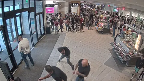 BREAKING UPDATE: Albuquerque Police Department just released surveillance footage of 15-year-old Isaiah Montoya the suspect in the Friday shooting at Coronado Center. Video shows Montoya chasing a teen through the mall, finally stopping at an exit, waving to the teen to exit with him. The teen approaches the doors when Montoya fires the shot, from outside Coronado Center. People can be seen ducking and running after the shot rang out. An off duty BCSO Lieutenant runs after Montoya. Authorities report a bullet hole was left above the entrance to the mall, and a gun matching the firearm used by Montoya, was discovered near the area on Saturday. #kkobradio
