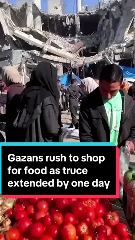 In Nuseirat refugee camp in the central Gaza Strip, Palestinians rush to an open-air market near the ruins of houses and buildings destroyed in Israeli strikes during the conflict, as a temporary truce between Hamas and Israel is extended for another day #Gaza #Israel #Palestine #C4News