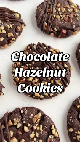 🎄12 days of Christmas cookies🎄 Recipe 5 Chocolate hazelnut cookies! Chewy and fudgy, chocolate cookies, filled with Nutella, rolled in hazelnuts, and drizzled in chocolate! Click on the photo linked in my profile for the recipe or head to https://cakemehometonight.com/chocolate-hazelnut-cookies/ #christmascookies #nutella #chocolatehazelnut #holidaybaking 