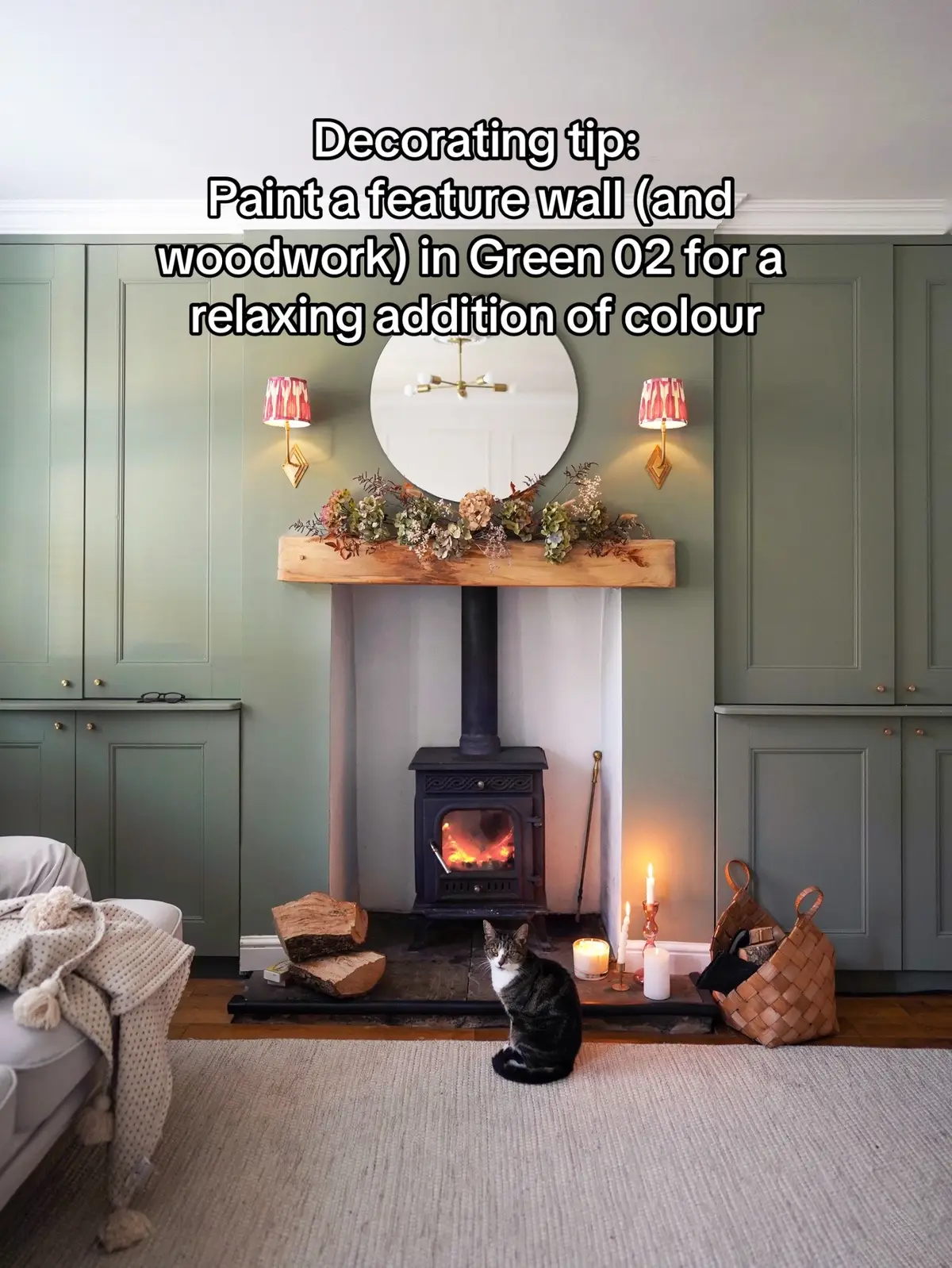 Looking for a way to incorporate soft sage green paint into your home - we’ve found it!  Inspired by @Aimée’s cosy living room design paired with off-whites, layered fabrics and a pop of complementing red accents. #LickHome #decoratingtip #interiordesigntips #ukhomerenovation #livingroommakeover #cosylivingroom #colourpalette #winterhomedecor #farmhouselivingroom #featurewallideas 