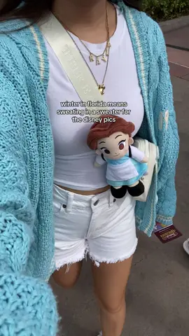 brought the 1989 cardigan out 🤭 #epcot #festivaloftheholidays2023 #disneyworld #disneytok #christmas #winterinspo #OOTD #outfitinspo #swiftie #taylorswift #florida 