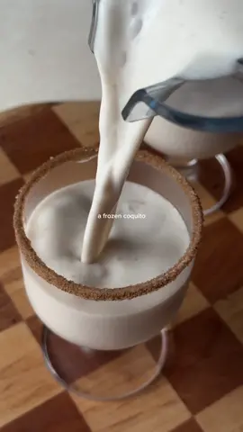 frozen NA christmas coquitooo 🥥🌴🎅 ingredients// (makes 2) 4oz NA rum 2oz maple syrup 2oz coconut milk 1/2 cup almond milk 6 coconut milk ice cubes 1/4tsp nutmeg 1tsp cinnamon 1/2tsp vanilla 1/4tsp salt 2-3tbs shredded coconut cinnamon + sugar (for the rim) #coquito #holidaymocktail #mocktailrecipe #holidaycocktail #nonalcoholicdrink #frozenmocktail #christmascocktails 