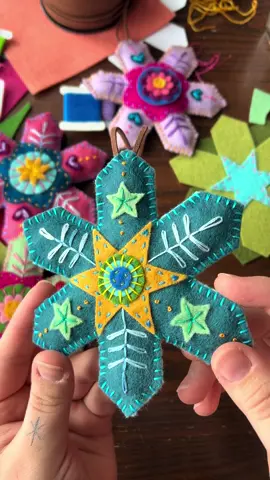 Felt snowflake stitching! ❄️ The colors on this one plus the stars made the vibe a little “under the sea” but it’s still super cute.  #modernembroidery #fiberart #embroideryart #handstitched  #dmcembroidery #michiganartist #bordados #feltart #ornaments #christmas