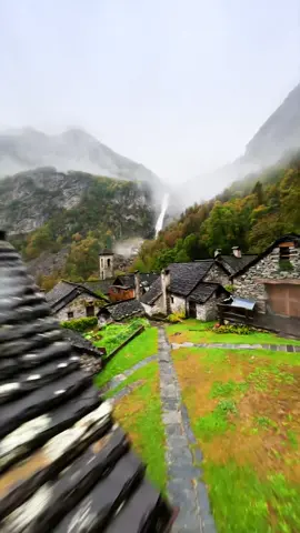 Through the bell tower to the waterfall 🍂 This was one of the most beautiful places I’ve ever flown my drone 🥰 I was a bit afraid of getting stuck in the bell tower and not being able to get it back 😂  #switzerland #fpv #drone #foroglio #travel #nature #village #bell #oldvillage #waterfall