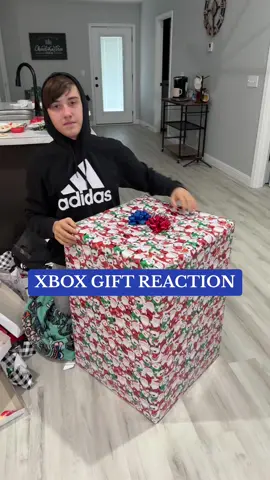 Watch till the end for all his reactions and what he says 🤭 He was over it after the third box and said what if I just throw whatever it is on the ground? I said you will really regret that 😂 #merrychristmas #xboxrevealed #fyp #presents #christmasday #whathegotforchristmas #santadidgoodthisyear #xboxtiktok #reactionvideo #prankvideo #nicelist #xboxseriesx #bigpresent #christmastiktok #xboxaddict #xboxgift 