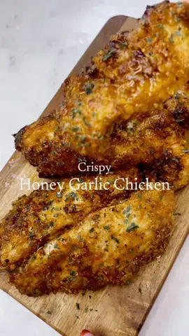 Airfryer honey garlic chicken tenders. Perfect high protein chicken recipe. Add to a salad, serve with chips or just as they are. So easy to make and so delicious! Recipe for 2 portions  Air fryer 10 mins - 12 mins at 200c  2x chicken breast cut into strips  Chicken seasoning  1x tbsp  - Onion granules - Cajun seasoning  - Smoked paprika  - Garlic granules/powder - Salt & pepper  Cornflakes seasoning  30g cornflakes 1x tbsp - onion granules - Cajun seasoning  - Salt & pepper 1x egg whisked  Sauce  2x tbsp garlic puree  2x tbsp soy sauce  2x tbsp sweet chilli sauce 2 x tbsp honey 1x tbsp chilli flakes  1x tbsp dried coriander  #airfryer #airfryerrecipes #chickentenders #honeygarlicchicken #crispychicken #easymeals #simplerecipe #highprotein #healthymealideas #foodtiktok #foryoupage #fyp #fypシ #CapCut 