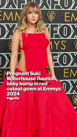 Suki Waterhouse put her baby bump on display in a gorgeous red gown on the Emmys 2024 red carpet.