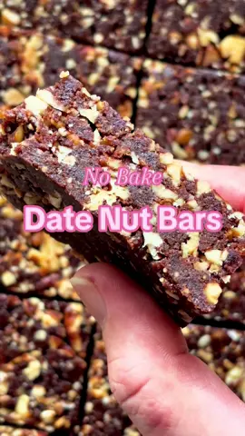 Easy #nobake date nut bars! These healthy treats are high in protein, fiber, and antioxidants. They’ll satisfy your craving for sweets with just a few ingredients.  -12 medjool dates -1/2 cup nut butter -2 tbs cocoa powder -2 tbs flaxseed meal -1 cup Candied Pecans -1 cup Candied Walnuts Soak dates in warm water for 5 minutes. Drain. Blend them in a food processor along with nut butter, cocoa powder, and flaxseed meal. Add nuts and pulse to combine. Press into a parchment-lined tray. Freeze for 1 hour before slicing. Store in an airtight container in the fridge.  #EasyRecipes #santenuts #highprotein #easysnack #datebars #nutsfornuts #tiktokfood 