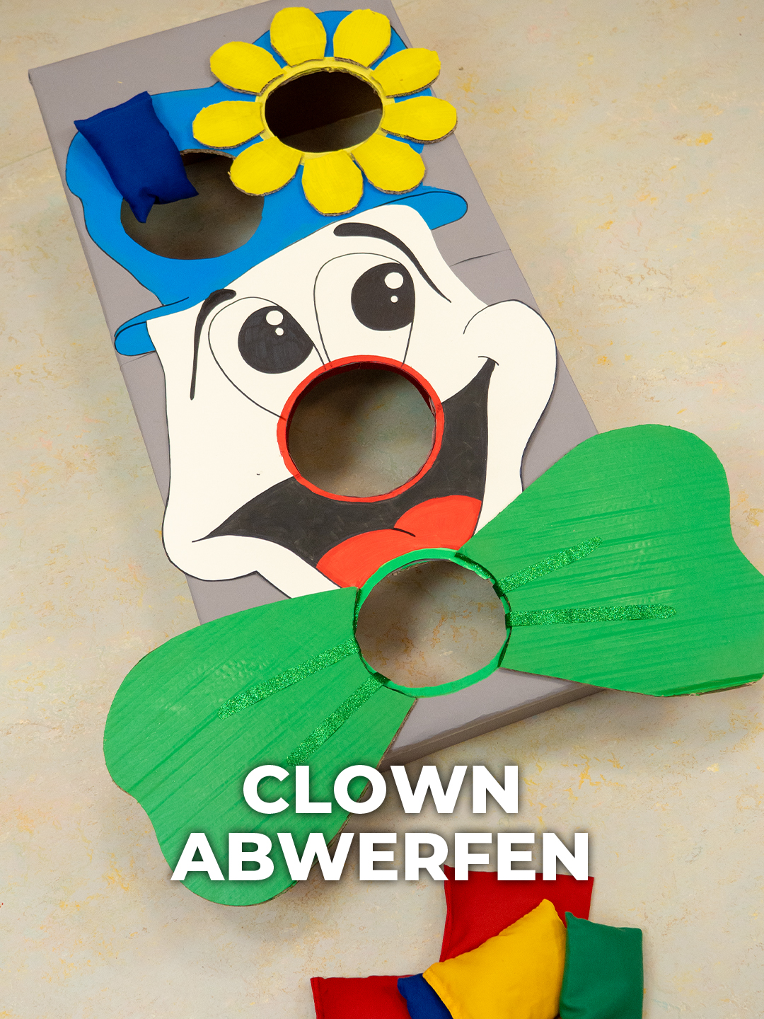 Originelle Wurfspiel-Idee für die Faschingsparty: Bastele aus einem Karton diese Cornhole-Variante im fröhlichen Clown–Design 🤡 #jetztkommtkurth  #karneval  #fasching  #upcycling  #diyspiel  #clown  #wurfspiel  #sackloch  #cornhole #fyp