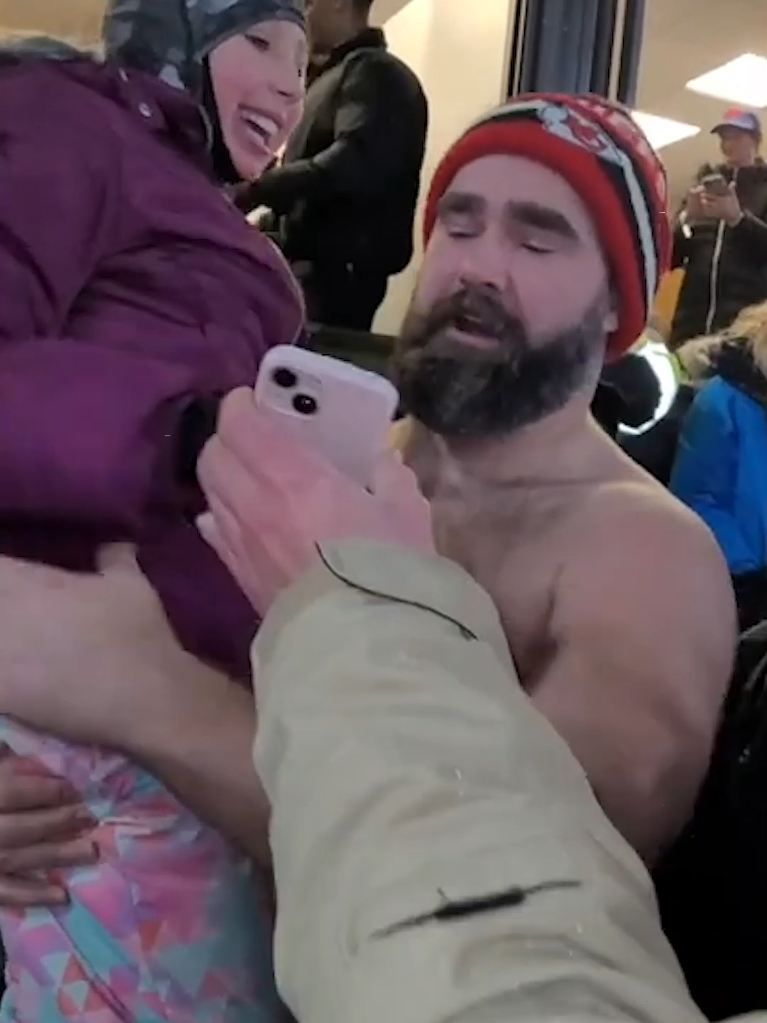 Not all heroes wear capes... or shirts. Jason Kelce was seen lifting up a young fan towards Taylor Swift’s box at Sunday's Chiefs-Bills game, allowing the little girl to display her sign to the singer. 