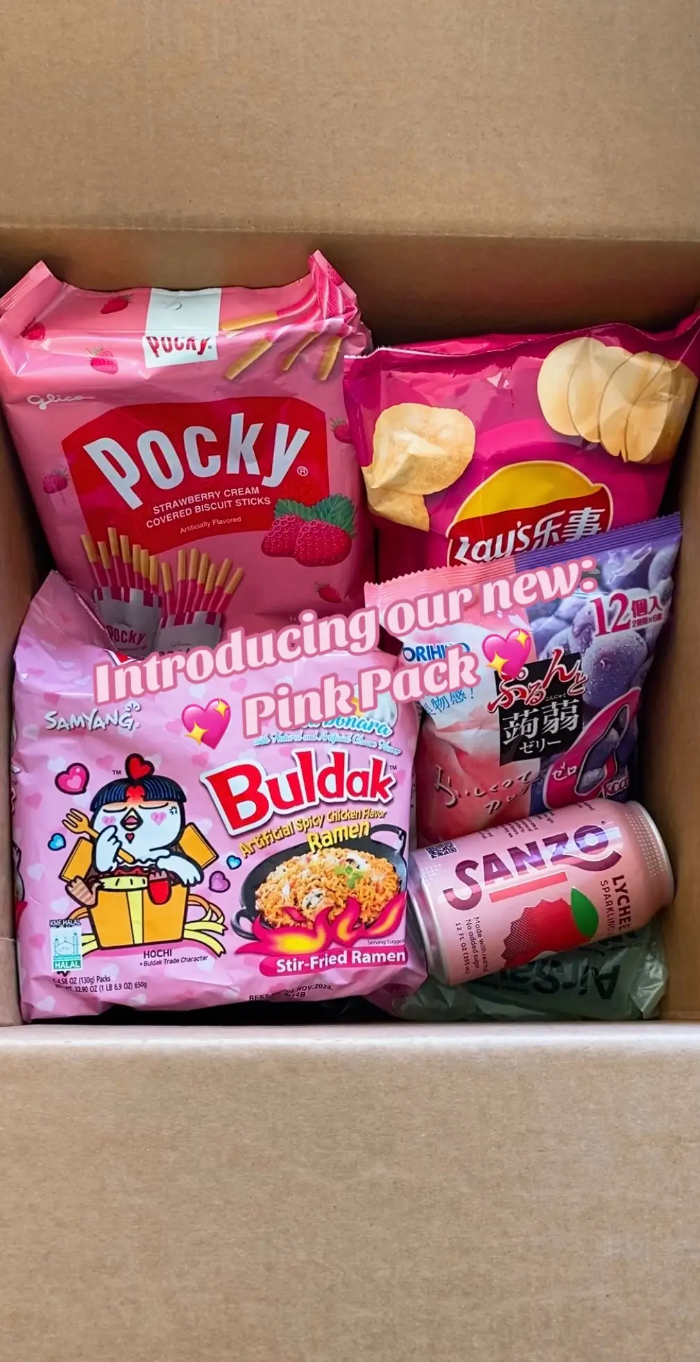 This week: a hot new bombshell enters the villa. Get our 💖 Pink Pack 💖 today! Featuring: Lychee sparkling water, Peach & Kyoho Grape jellies, Mexican chicken tomato flavored potato chips, Strawberry Pocky and of course, Buldak Carbonara! 😘 Get it on our #TikTokShop today!  #pink #buldak #ramen #asianfood #sparklingwater #pocky #strawberry #chips #potatochips #peach #kyohojelly #jelly #kyohograpes #peachjelly 