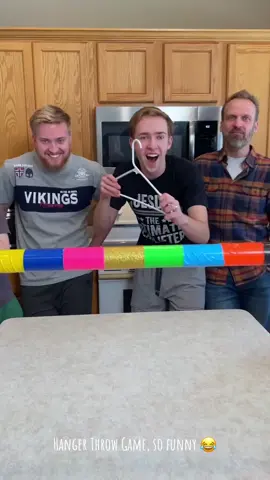 Kids, Dad, and family play diy at-home game show with clothes hanger and pvc pipe for fun candy and cash prizes. Great challenge for some family fun. (for entertainment purposes only)