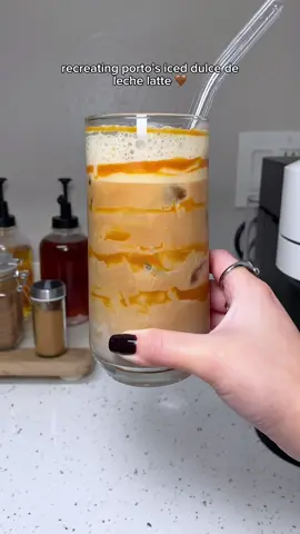 recreating @Portos Bakery & Cafe iced dulce de leche latte 🤎  🤎 la lechera dulce de leche 🤎 @Nespresso USA iced leggero pod 🤎 oat milk  machine is @Nespresso vertuo next  #iceddulcedelechelatte #dulcedelechelatte #nespressovertuo #nespressoreceipe #coffeetime #starbucksathome #athomecoffee #coffeerecipes #easycoffeerecipes #portos 