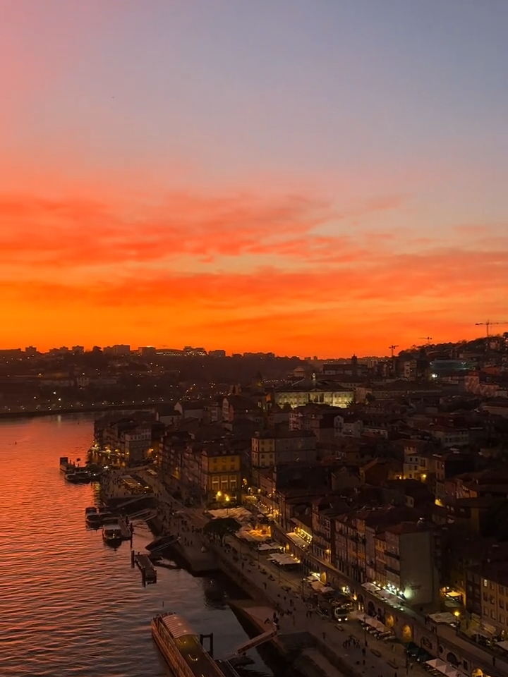 Lose yourself in the radiant charm of a 📍Porto Portugal sunset, painting the sky with a palette of orange hues 😍 🎥 @sarah_lo01  #PortugalSunset  #portotravel  #portugalvisit  #europetrip