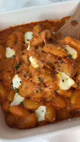 baked gnocchi alla vodka 😋❤️ #gnocchi #vodkasauce #fyp #FoodTok #EasyRecipe #bakedgnocchi // RECIPE ⬇️ Ingredients: 1 package gnocchi 1/2 cup tomato paste  1 clove garlic, minced 1 small onion, diced 3 tbsp butter 1 cup heavy cream 1/2 cup parmesan 3 tbsp vodka Red pepper flakes Mozzarella Fresh parsley Directions: - Sauté diced onion and garlic in butter - Add tomato paste and mix together for a few minutes - Deglaze pan with vodka, let it cook off - Stir in cream and simmer on low heat - Add red pepper flakes, grated parmesan cheese and fresh parsley - Cook gnocchi according to package directions, reserving some water - Combine cooked gnocchi with sauce, adding reserved water if needed. - Transfer gnocchi to a baking dish, top with mozzarella balls and sprinkle of parmesan cheese - Bake at 400°F for 10 mins or until cheese is melted and starts to brown - Finish with more parmesan and parsley (or basil). Serve & enjoy!