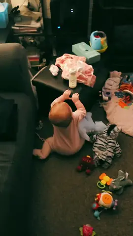 The way she pulls herself up to get her bottle an then tries to put it back 🤣🥰#babiesoftiktok#babytok#smartbaby#mom#momlife 