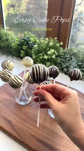 Oreo & Lotus Cake Pops Recipe 🍭 Easy No-Bake Dessert on a Stick! #oreo #lotus #cakepops #asmr #easy #tiktok  Ingredients: Oreo Cake Pops - 180g Oreo cookies (1 ½ cup)(about 16 pieces) - 60g cream cheese (¼ cup) - 150g chocolate (1 cup) (for coating) - 3g coconut oil (½ tsp) Lotus Cake Pops - 125g Lotus Biscoff cookies (1 cup) (about 12-15 pieces) - 90g cream cheese (½ cup) - 150g chocolate(1 cup) (for coating) - 3g coconut oil (½ tsp) — — —  Instructions: - Crush the Lotus Biscoff cookies into fine crumbs using a food processor or by placing them in a sealed bag and crushing with a rolling pin. - In a bowl, combine the crushed Lotus Biscoff crumbs with cream cheese until well mixed.  - Chill the mixture in the refrigerator for 10 minutes. - While waiting for the mixture to cool down, perform the same process with Oreos. - Take small portions of the mixture and roll them into small balls. Place them on a tray lined with parchment paper. - Freeze for about 1 hour or until they are firm. - Melt the chocolate using a double boiler or microwave, add coconut oil and stir until smooth. - Insert a lollipop stick or wooden skewer into each ball. - Dip each ball into the melted chocolate, ensuring it’s fully coated.  - Allow any excess chocolate to drip off. - Place the coated Oreo and Lotus Cake Pops back on a wire rack or the parchment paper-lined tray and let them set. - Decorate with sprinkles or drizzle additional melted chocolate on top. - Allow the chocolate coating to fully harden before serving. Enjoy your delicious Cake Pops! — — —  #CakePops #DessertMagic #OreoLove #LotusBiscoffDelight #NoBakeTreats #SweetToothSatisfaction #EasyDesserts #ChocolateLovers #DessertOnAStick #FoodieFiesta #HomemadeSweets #PartyTreats #YummyInMyTummy #FoodGoals #InstaWorthyEats #SweetIndulgence #QuickAndDelicious #CreativeBaking #DessertIdeas #DroolWorthyDesserts  