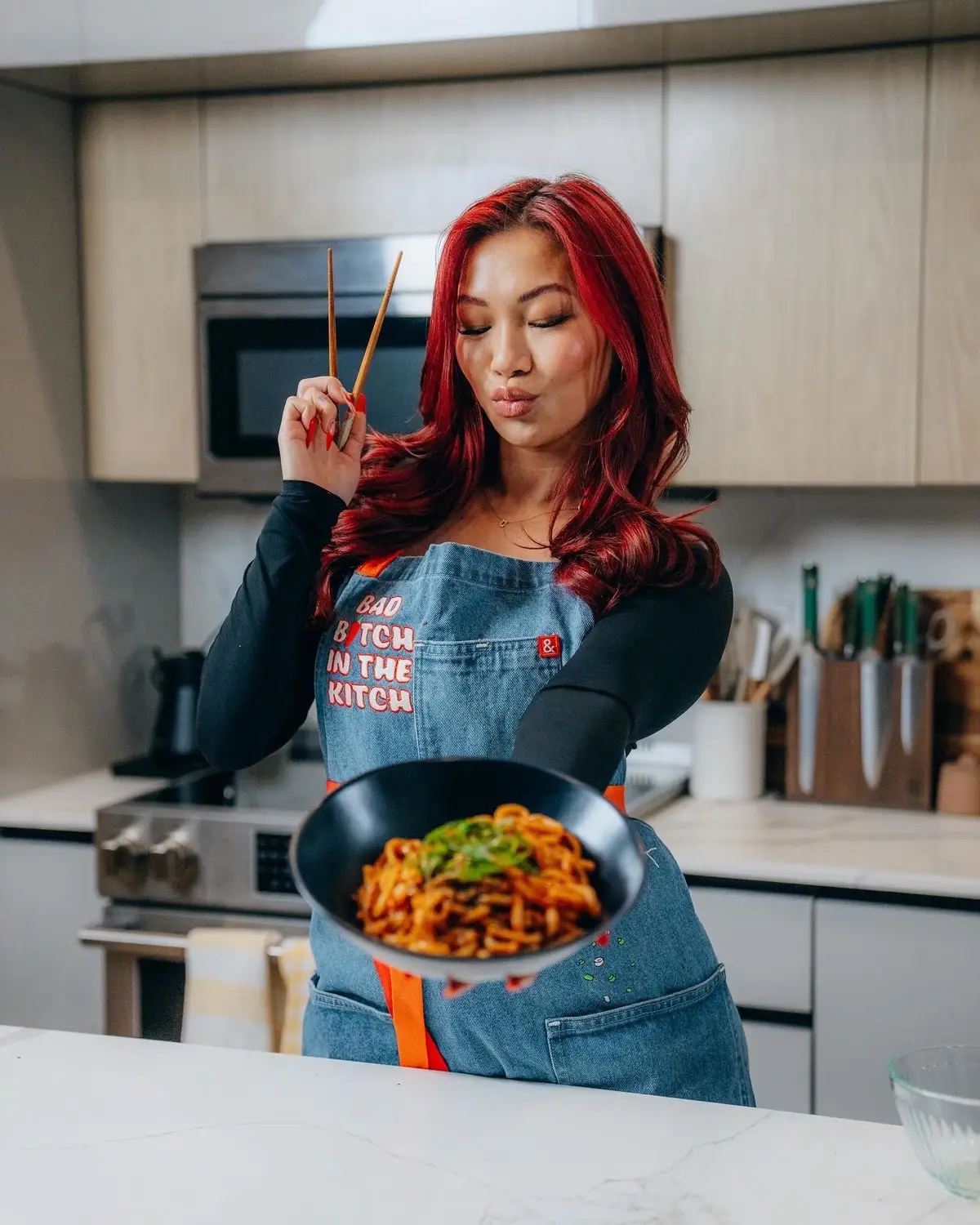 BAD B*TCH IN THE KITCH Apron available TOMORROW 2/6 at 9:30am PT/12:30pm ET 🌶️💅🔥 @Hedley & Bennett 